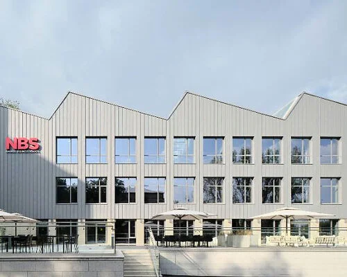 Renovated Metal Sawtooth Roof Enhances Narxoz University Business School in Almaty